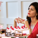 Image for article titled Single Woman Seated At Wedding’s Dessert Table